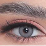Close-up of an eye wearing 3D Colors Dove colored contact lenses