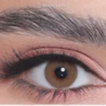 Close-up of an eye wearing 3D Colors Hazel colored contact lenses