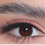 Close-up of an eye wearing 3D Colors Ochre colored contact lenses