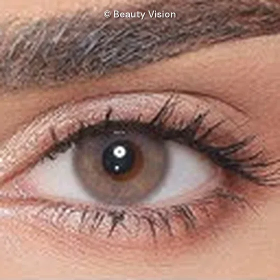 Close-up of an eye wearing Luminous Almond colored contact lenses