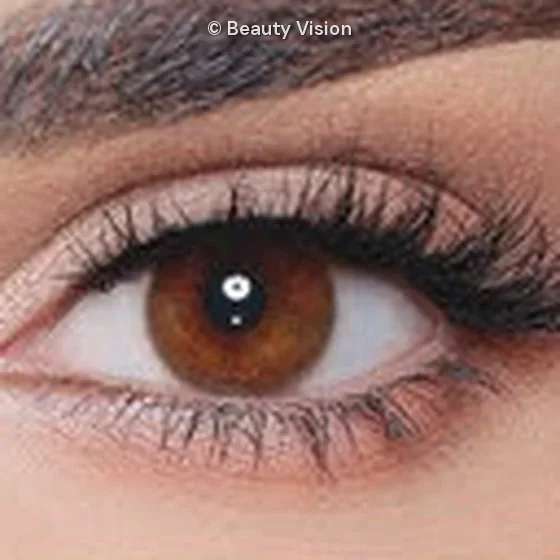 Close-up of an eye wearing Luminous Cappuccino colored contact lenses