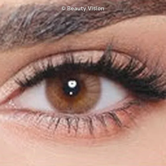 Close-up of an eye wearing Luminous Coffee colored contact lenses