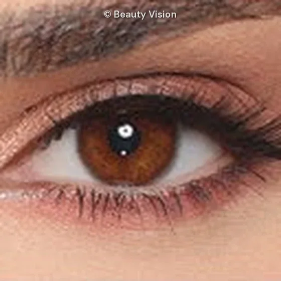 Close-up of an eye wearing Luminous Espresso colored contact lenses