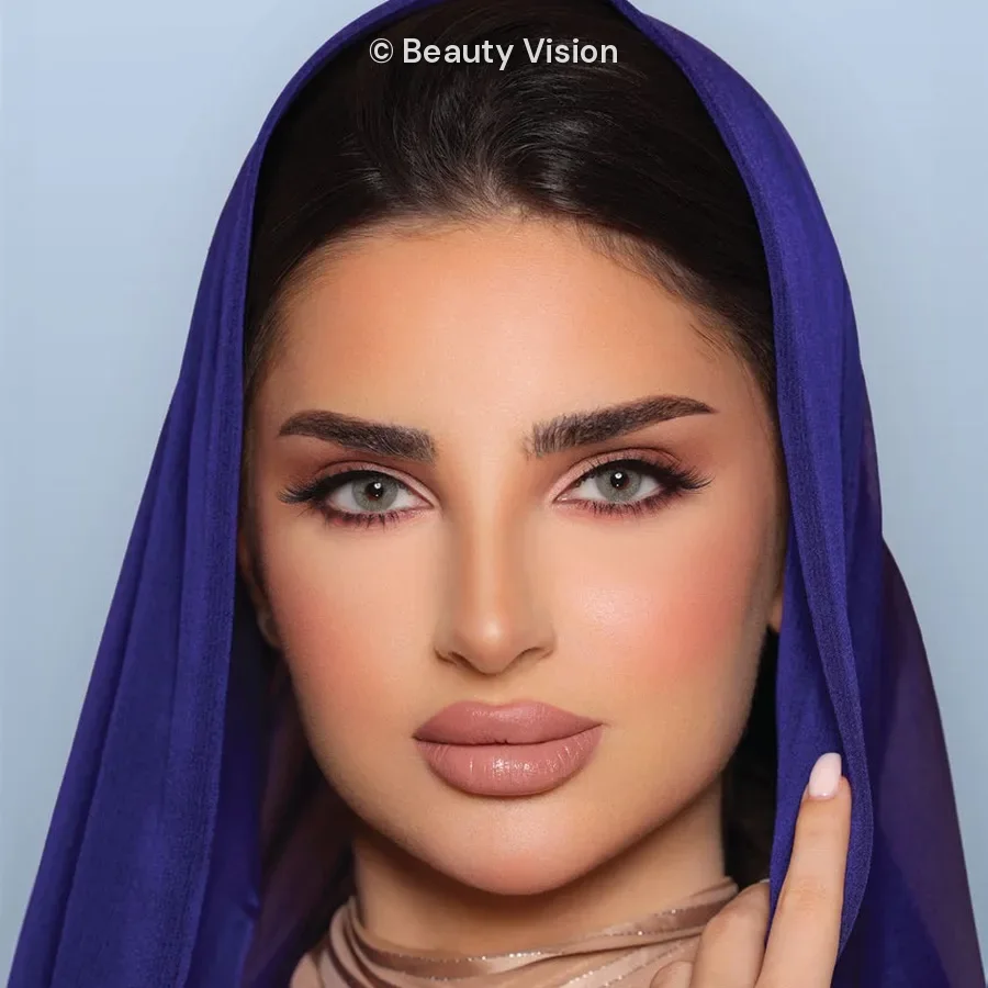Model wearing Luminous Lazord colored contact lenses
