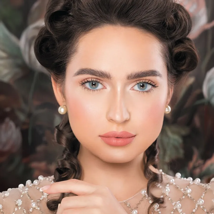 Model wearing Naturèl Core Blue colored contact lenses